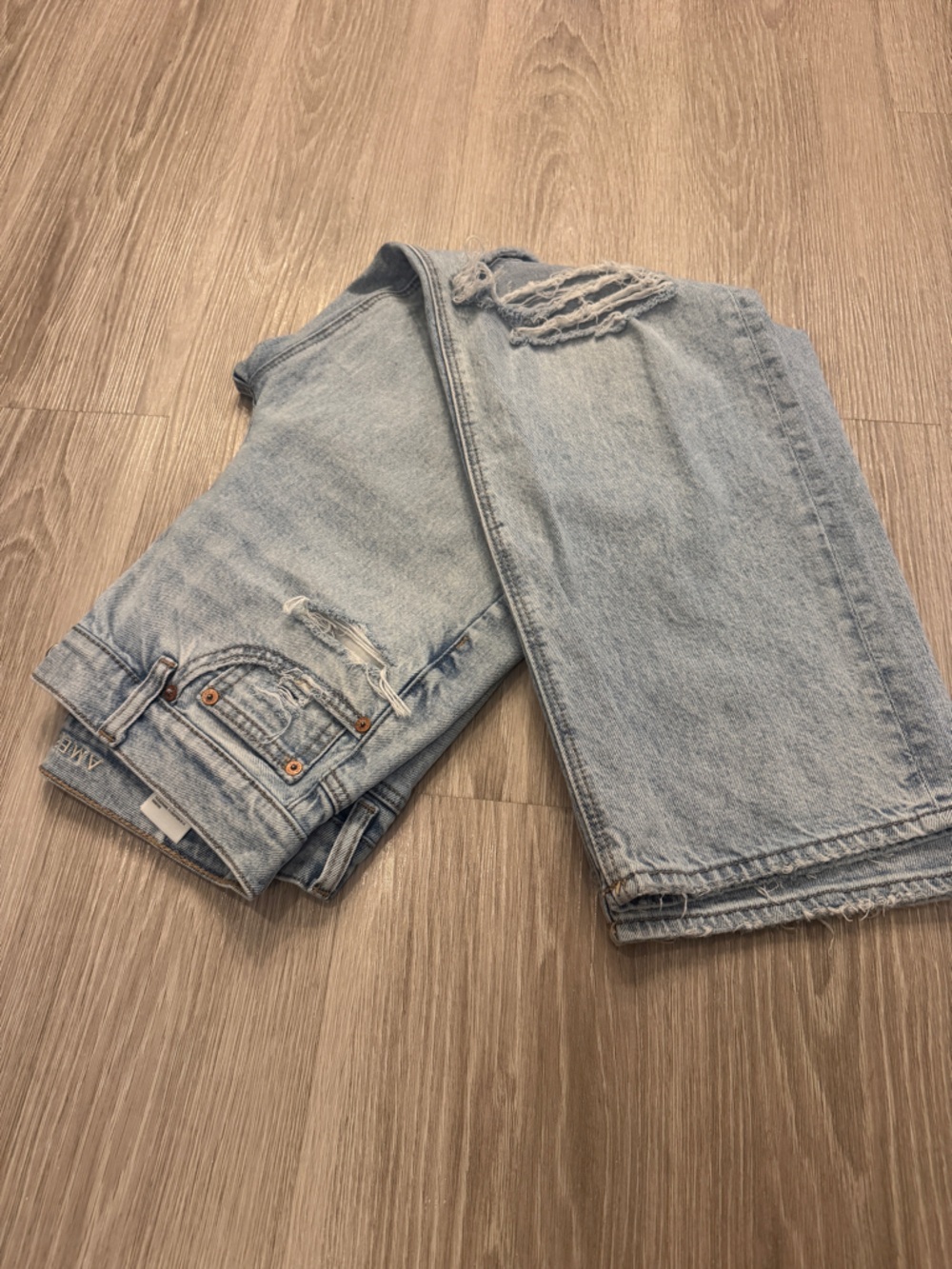 American Eagle Outfitters Light Blue Denim Jeans with Tan Stitching